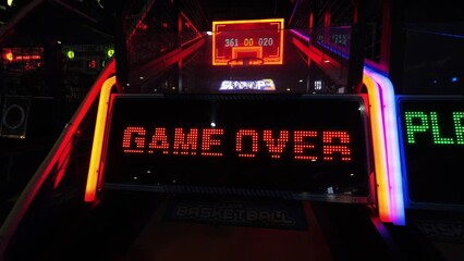 Game over leds text flashes on the slot machine in the entertainment game cente, high quality 4K videogame ending screen animation. - Powered by Adobe