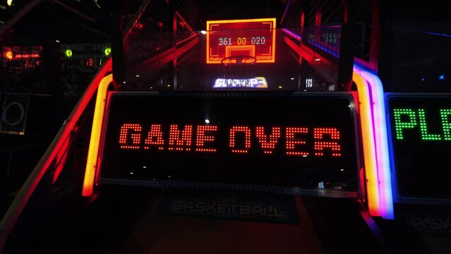 Game over leds text flashes on the slot machine in the entertainment game cente, high quality 4K videogame ending screen animation. - Powered by Adobe