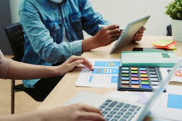 Group of asian creative team programing designers participate in all phases of the UX UI design.