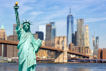 New York City skyline of Manhattan with Statue of Liberty, Brooklyn Bridge and World Trade Center...