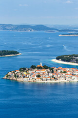 Fototapeta premium Primosten town on a peninsula vacation in the Mediterranean Sea portrait format in Primošten, Croatia