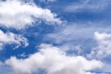 Blue sky with white fluffy clouds. Cumulus clouds background. Cloudscape morning sky. The concepts of freedom of live, never give up and positive though energy.	