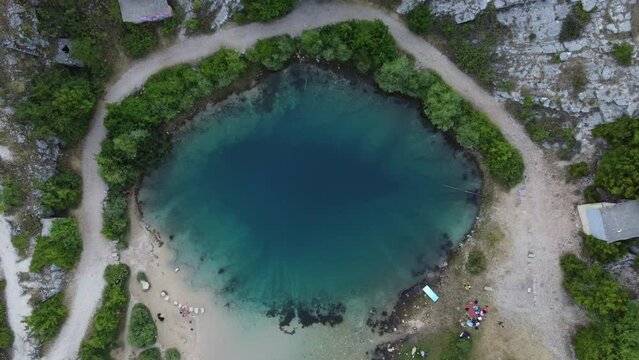People at Cetina River Spring (Izvor Cetine), also known as Eye Of The Earth, a cold karst spring, Croatia. Aerial