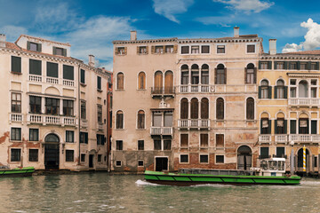 Fototapeta na wymiar Canal with boat in Venice