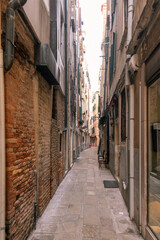 Fototapeta na wymiar View of a narrow street in Venice