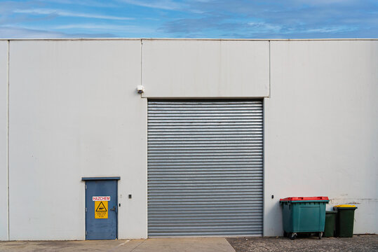 An industrial rolling door of a warehouse.