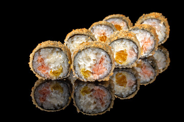 Fried tempura sushi rolls set close up selective focus. Japanese traditional food, restaurant menu background