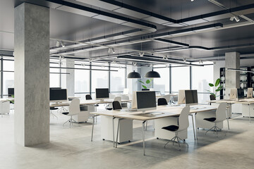 Comfortable workplaces in an open office interior with desks, computers, and a window. The design is sleek with a concrete floor and black ceiling. Business background. 3D Rendering