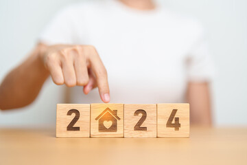 Happy New Year 2024 with Home and Heart block. Property investment, House Mortgage, Real Estate...