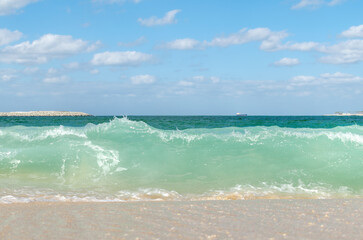 sea wave, against the blue sky