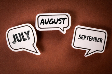JULY AUGUST SEPTEMBER. Three speech bubbles with text on a brown background