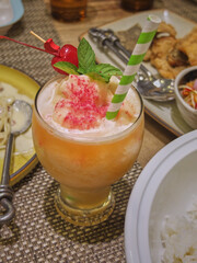 Close up the glass of healthy drink on dinning table