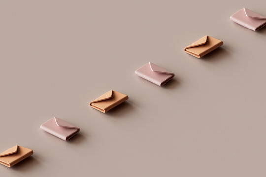 3D render of row of e-mail icons lying against brown background