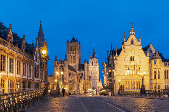 Belgium, East Flanders, Ghent, St. NicholasChurch seen from St MichaelsBridge at dusk