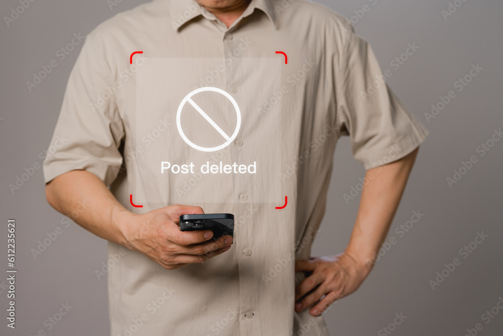 Poster young man uses a smartphone or mobile phone to use social media but the post has been deleted. find 