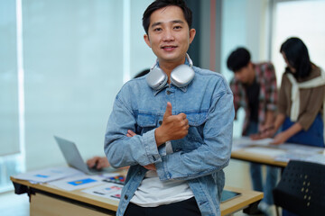 Group of asian creative team programing designers participate in all phases of the UX UI design.