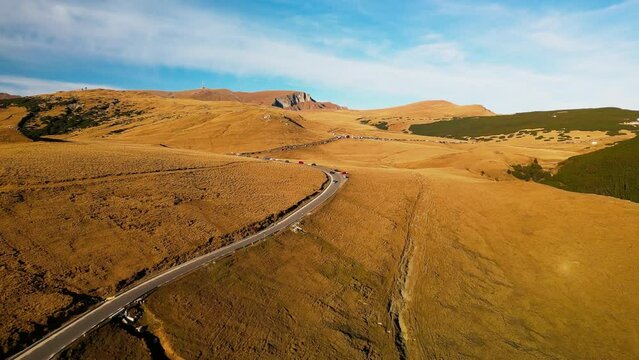 isolated scenic mountains narrowed road aerial view in pietra arsa mountains prahova valley Romania