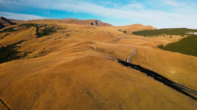 drone fly above scenic landscape in Romania mountains tourist destination for trekking and hiking pietra arsa