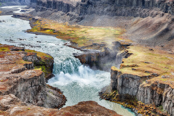 Breathtaking view of canyon and waterfall Hafragilsfoss.