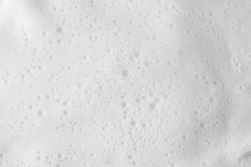 Abstract background white soapy foam texture. Shampoo foam with bubbles