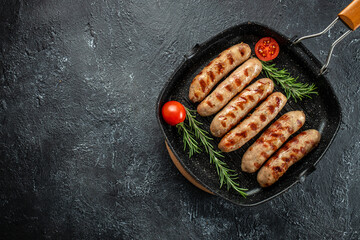 Roasted pork meat sausages on the grill pan. banner, menu, recipe place for text, top view