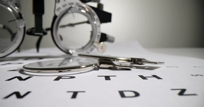 Glasses for selection of lenses in frame in background is ophthalmologist table. Treatment of farsightedness and myopia and astigmatism concept