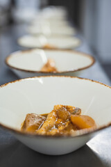 View of a serving of fish dishes in a restaurant kitchen.