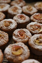Lots of muffins with apples shallow depth of field
