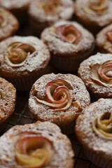 Lots of muffins with apples shallow depth of field
