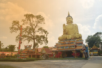 Pra Put Ratanamani Srihathai Naresuan or Luang Por Pan Lan large golden sitting outdoor Buddha in Wat Maniwong. It is a beautiful and faithful Buddha image. Located at Nakhon Nayok Province in Thailan