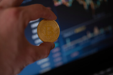 Bitcoin coin on computer background.The concept of investing in bitcoin and cryptocurrency....