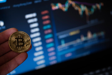 Bitcoin coin on computer background.The concept of investing in bitcoin and cryptocurrency....