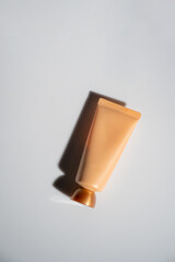 Plastic tube for cream or lotion. Skin care or sunscreen cosmetic on white background.