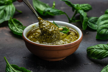 Traditional Italian pesto Basil, olive oil, parmesan, garlic, pine nuts. banner, menu, recipe place for text, top view