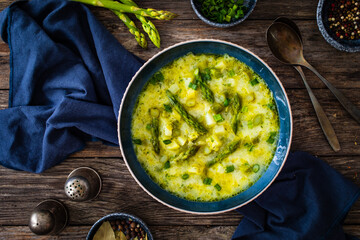 Asparagus soup on wooden table
