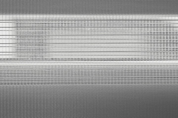 roller blinds background on the window,texture of roller blinds on a window close-up, mesh curtain...