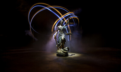 No law or dictatorship concept. The Statue of Justice with anti-riot police helmet holding scale....