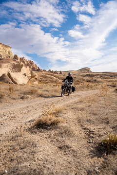 Man riding his Yamaha Tenere 700 motorcycle in Cappadocia, Turkey