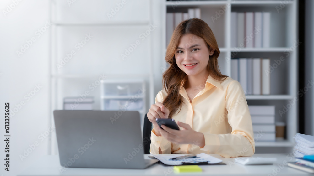Poster beautiful smiling businesswoman using a smartphone to work on various application including mobile t