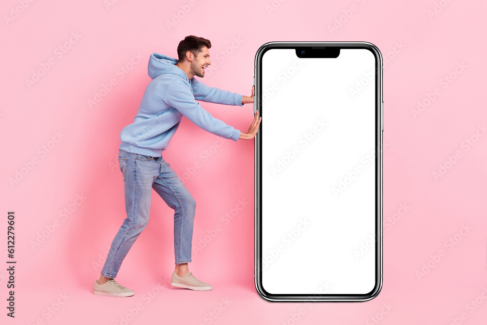 Poster full length photo of brunet hair young guy hard push smartphone screen menu app for online shopping 