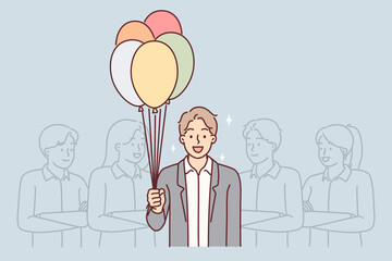 Business man with balloons stands near colleagues congratulating boss on birthday