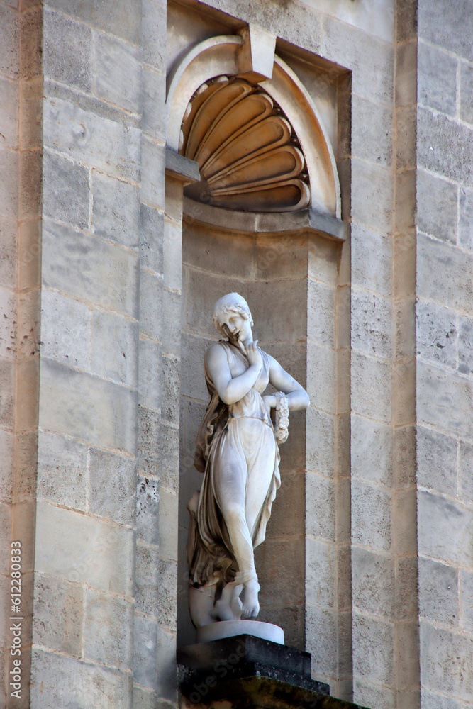 Wall mural Statue on a facade