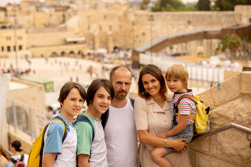European tourist family, visiting Jerusalem, meeting new culture