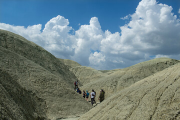 Obraz premium Trekking on Nallıhan Kız Tepesi. Ankara Nallihan Bird Sanctuary. Nallıhan Mountains are like Mars. Volcanic mountains in Turkey. Volcanic rocks and clouds in the sky. Trekking in Nallıhan.