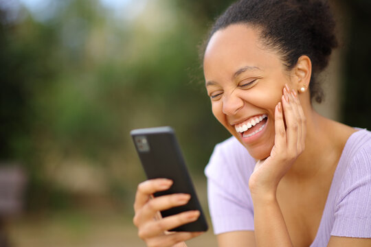 Funny black woman checking phone