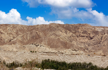 The famous Negev desert, clouds in Israel at sunset. Magic desert landscape, view of Negev stone, hill desert, Israel. Magic desert sand of Judean Mountains, wild nature Israel. Geological formation