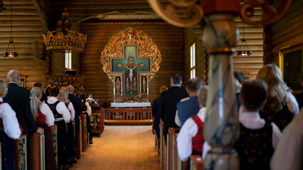 Fototapeta na wymiar Ancient altar in a Norwegian church during mass 