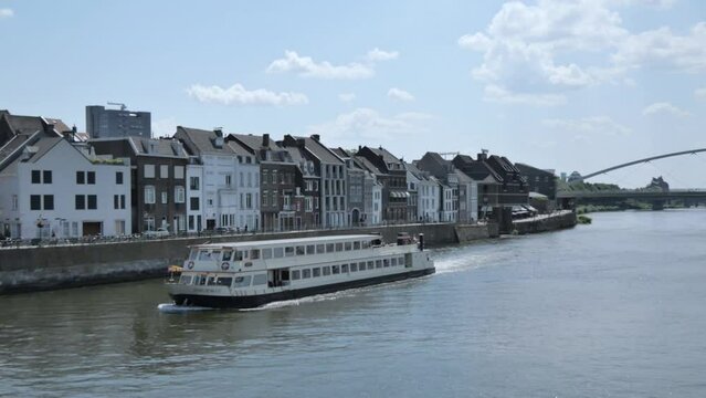 Beautiful view of the Maas (Meuse) river seen from the Sint Servaasbrug (St. Servatius Bridge) in Maastricht, Netherlands.