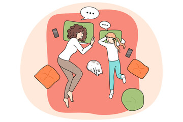 Happy loving young mother and teen daughter lying on bed at home chatting and talking. Concept of good parent child relationships. Mom and teenager have close relations. Vector illustration.