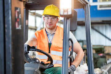 Portrait worker driving forklift in factory © KOTO